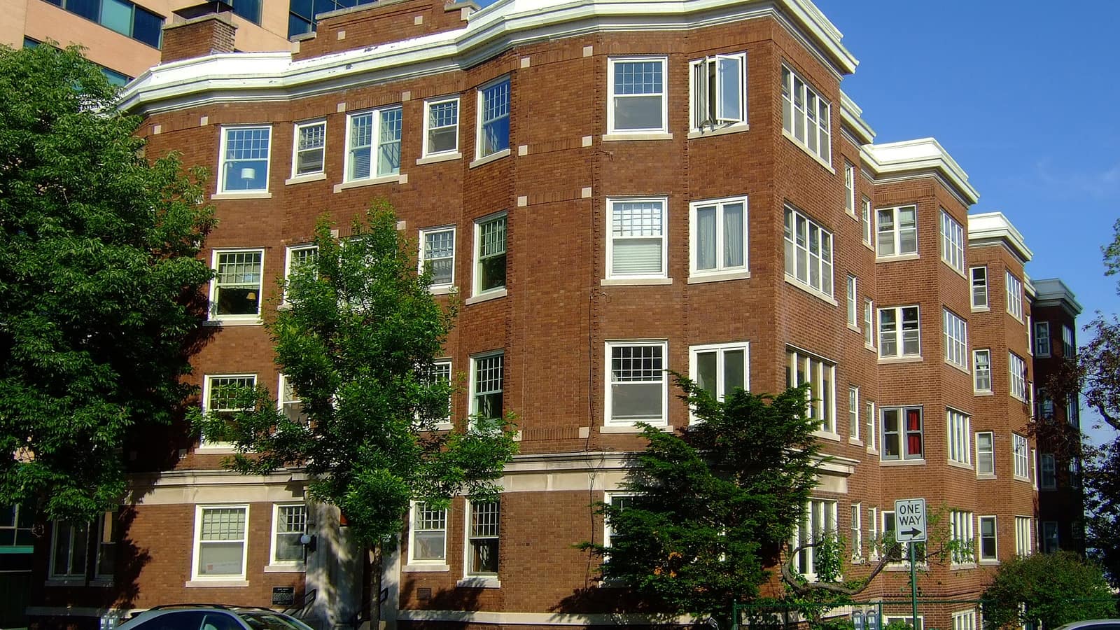 Brick apartment building with projecting window bays