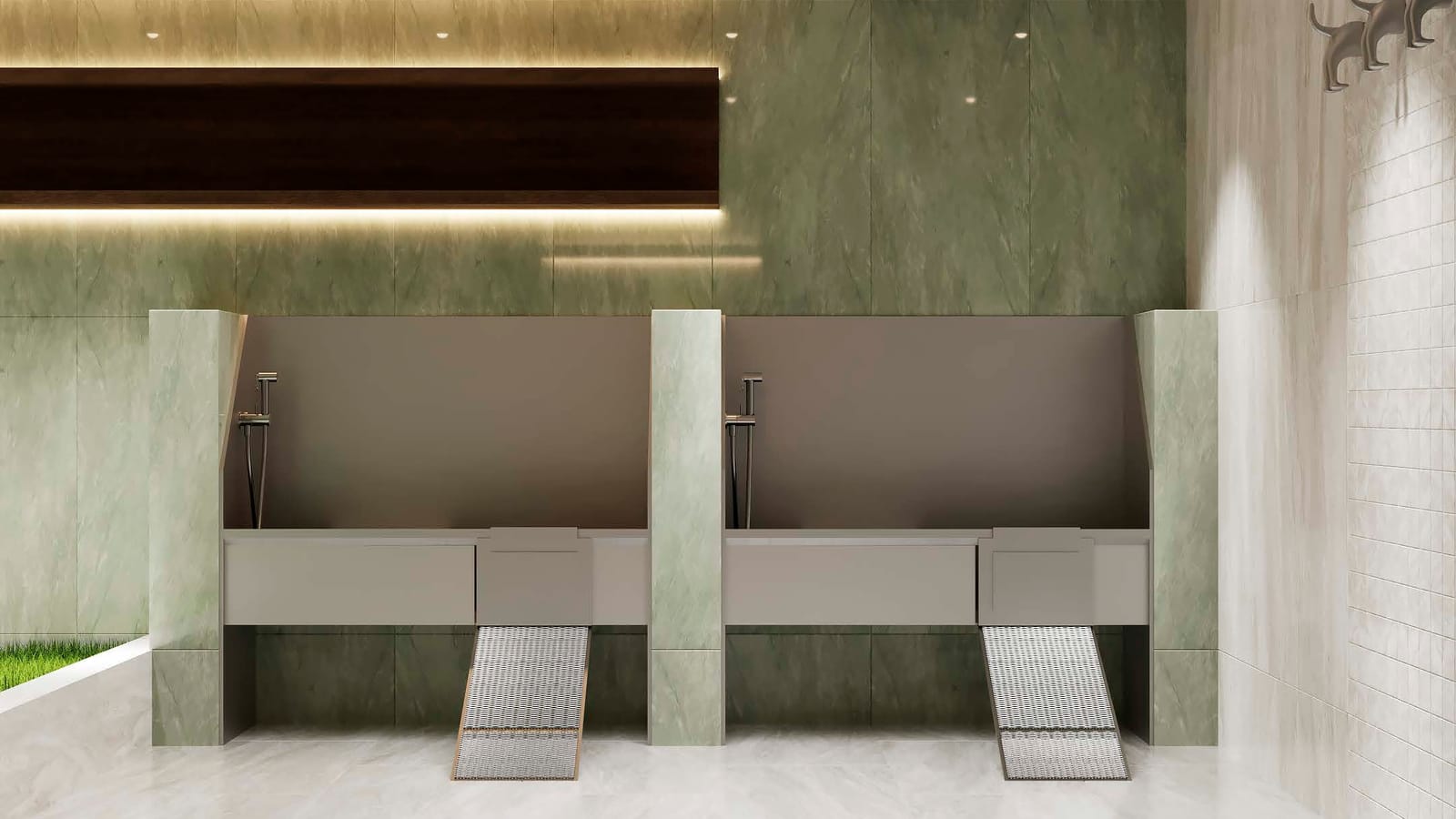 Rendering of a room with green stone-look walls and two raised washing tubs, each with a hand sprayer and a metal ramp leading up to it, and hooks shaped like dogs on the wall at the right