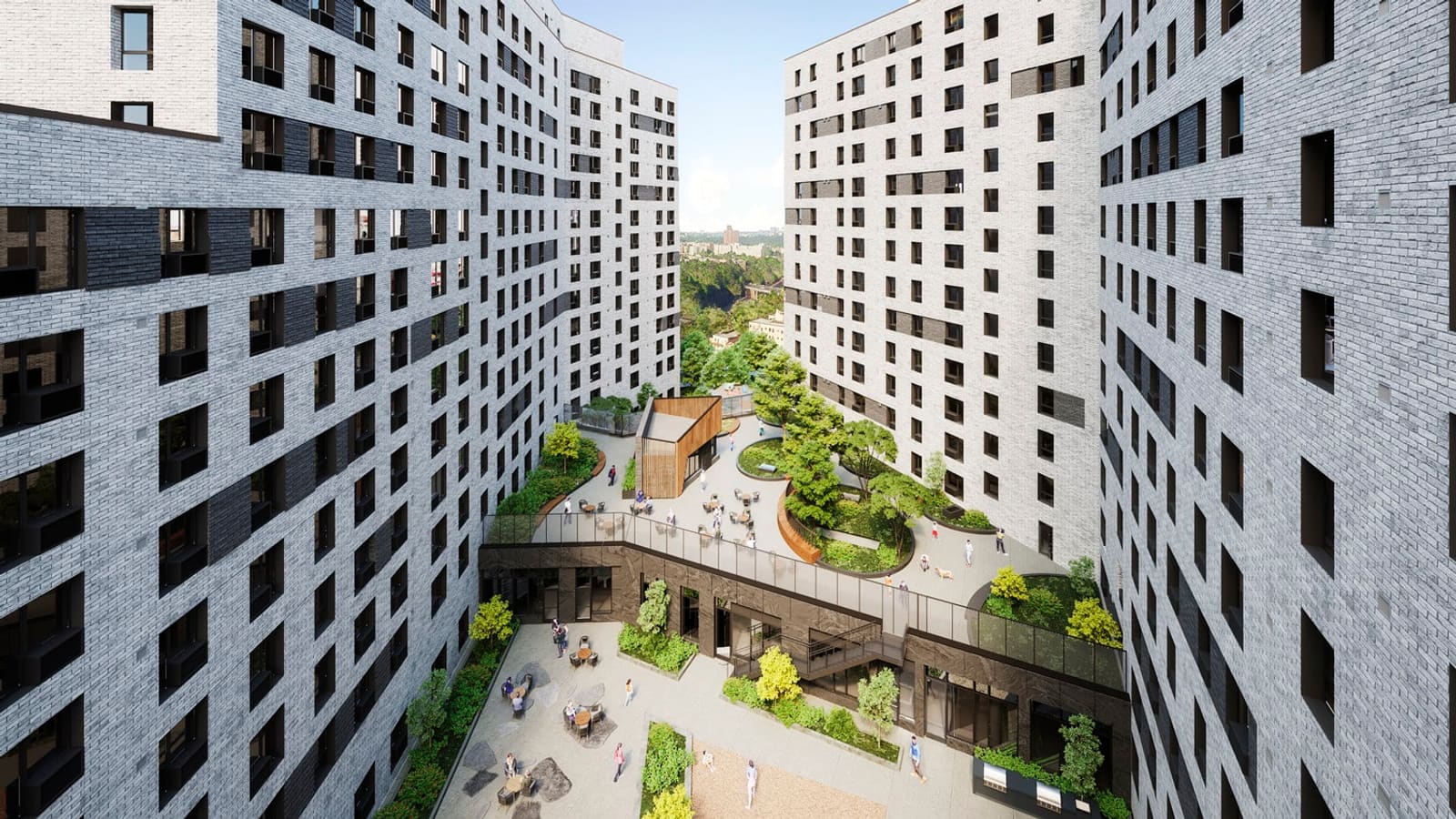 Rendering looking down between tall grey brick apartment buildings at a raised terrace with oval planters, trees, tables and a small wood-clad pavilion, above a lower paved yard with seating and planting, with a wooded hillside in the distance