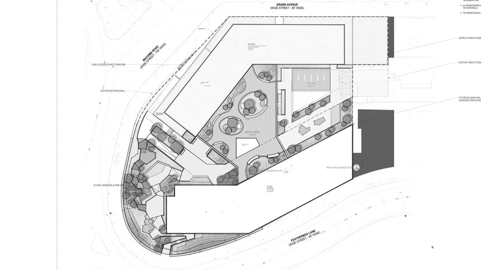 Black and white site plan of a rounded, wedge-shaped lot bounded by Macomb Road, Grand Avenue and Featherbed Lane, with one building footprint along Macomb Road and Grand Avenue, a blank footprint labelled future phase 02 along Featherbed Lane, and planted terraces, a rear yard and a landscaped area between and beside them
