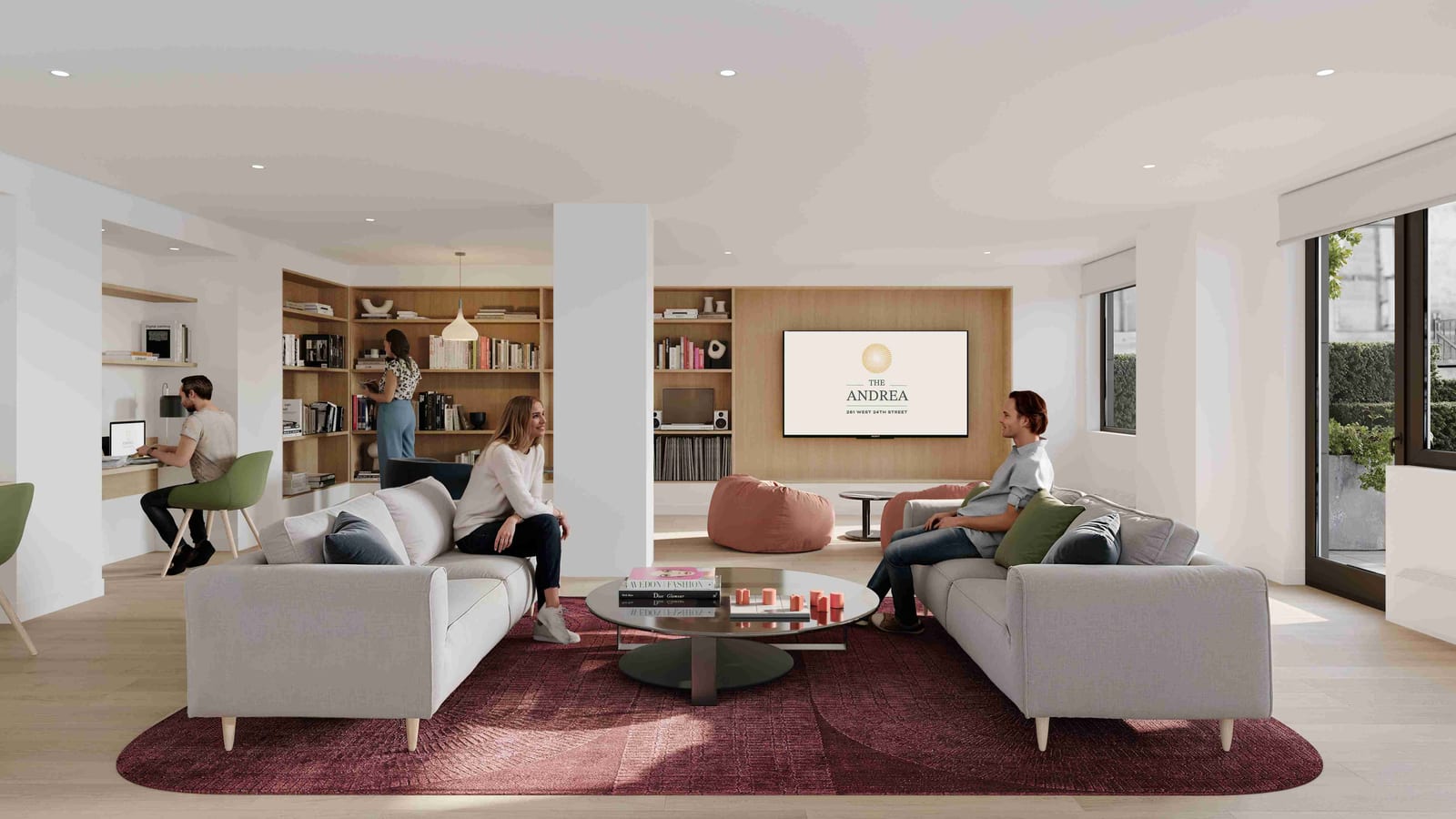 Rendering of a resident lounge with two pale gray sofas on a deep red rug, a round coffee table, a television showing The Andrea logo, wooden bookshelves, bean bags, a work desk at the left and glass doors to a terrace at the right