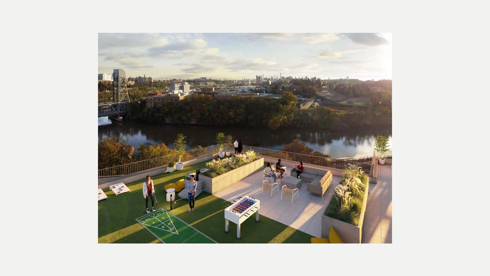 Rendering of a rooftop terrace with artificial turf, a shuffleboard court, a foosball table, cornhole boards, planters of grasses and outdoor sofas, with small figures, a river, wooded banks and a lift bridge beyond