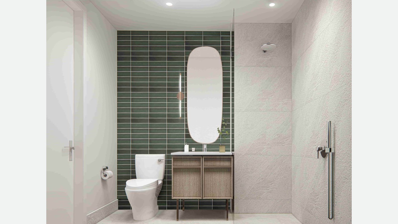 Rendering of a bathroom with a dark green tiled wall, a tall rounded mirror with a slim light, a wood vanity on legs, a white toilet, and a walk-in shower with pale stone-look tile, a glass panel and a hand shower