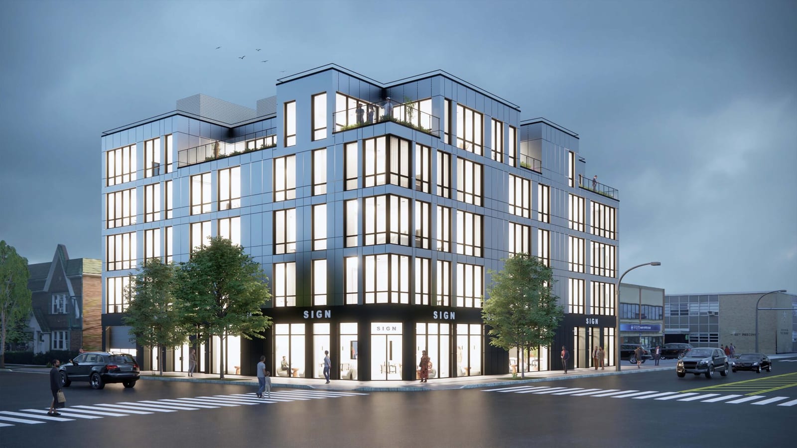 Rendering at dusk of a five-story corner building with light gray metal panels, tall black-framed windows, planted terraces with glass railings on the top floor and a black ground floor of lit shop windows under placeholder signs, with crosswalks, cars, street trees and small figures on the sidewalk