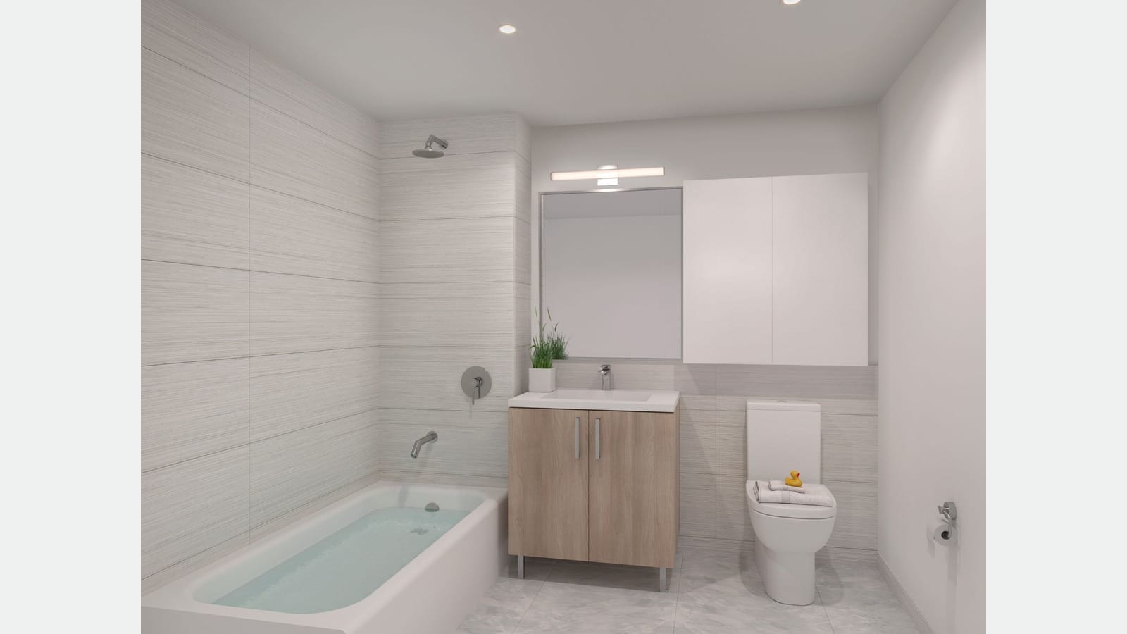 Rendering of a bathroom with gray striped wall tile, a white bathtub with a wall shower head, a light wood vanity with a white sink, a mirror and light above it, a white wall cabinet, a toilet with a rubber duck on folded towels, and a small potted plant