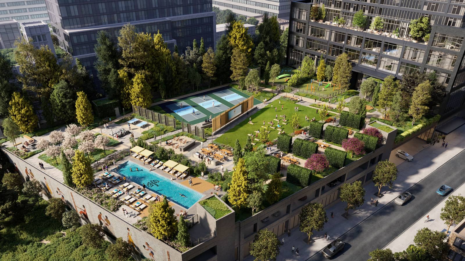 Aerial rendering of a landscaped deck beside a dark glass tower: a swimming pool lined with lounge chairs and cabanas, a lawn with an outdoor screen, three blue courts, rows of trees and hedges, a mural along the deck's outer wall and a street with cars at the right
