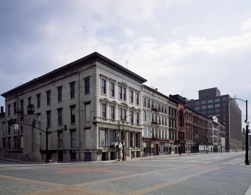 Historic commercial facades along a downtown Louisville street