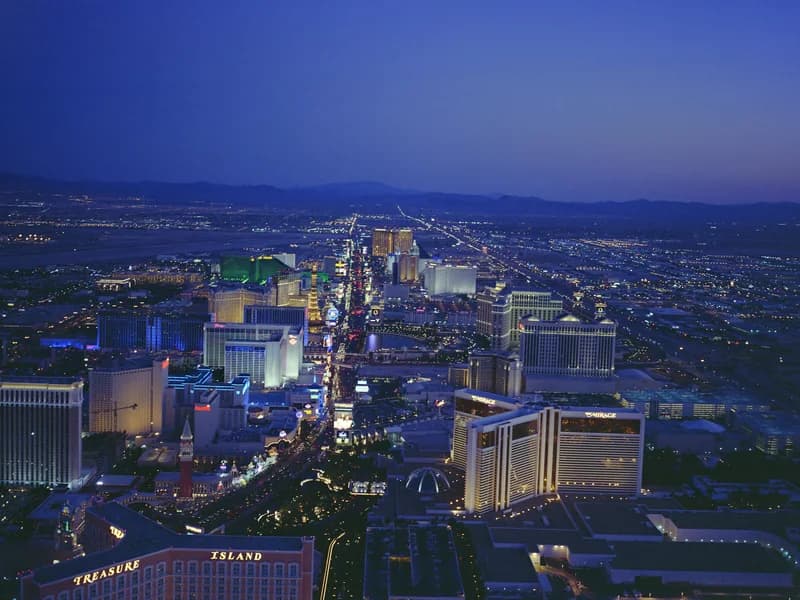 Archival Las Vegas Strip hotels and surrounding city at dusk