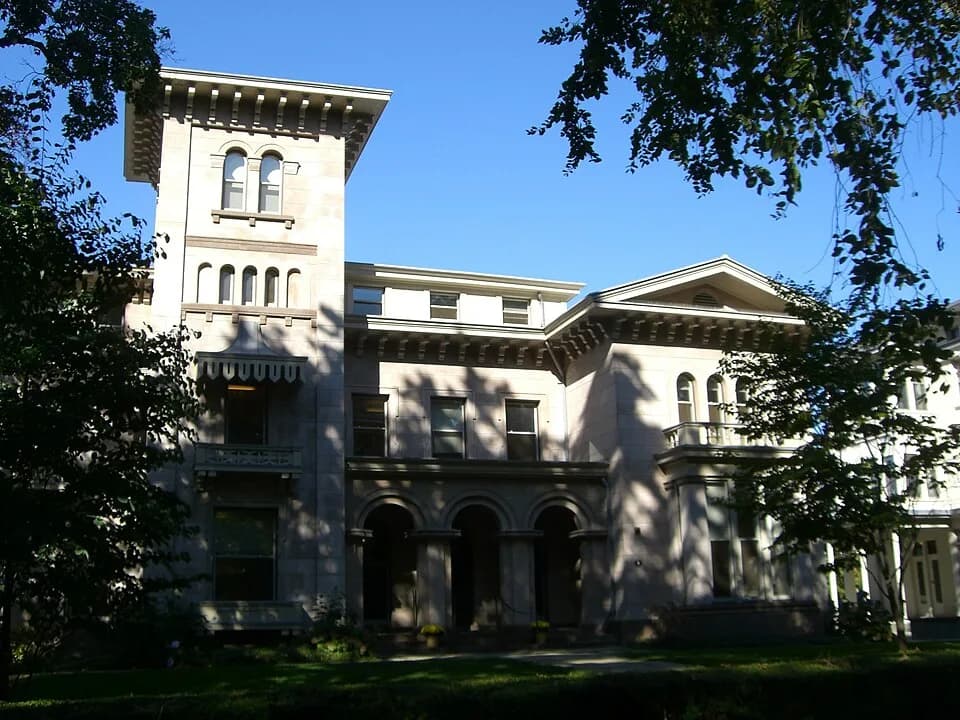 Historic house with a tower and columned entrance on Hillhouse Avenue in New Haven