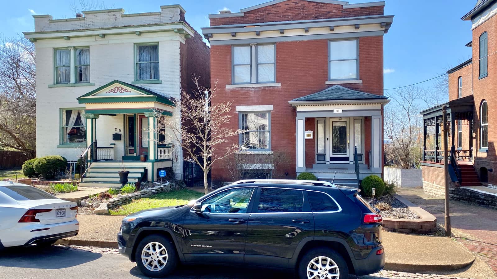 Brick townhouses with front porches on Benton Place in Lafayette Square, St. Louis.