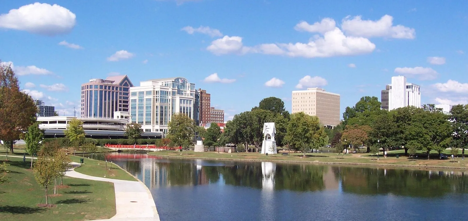 Downtown Huntsville buildings beside a landscaped pond