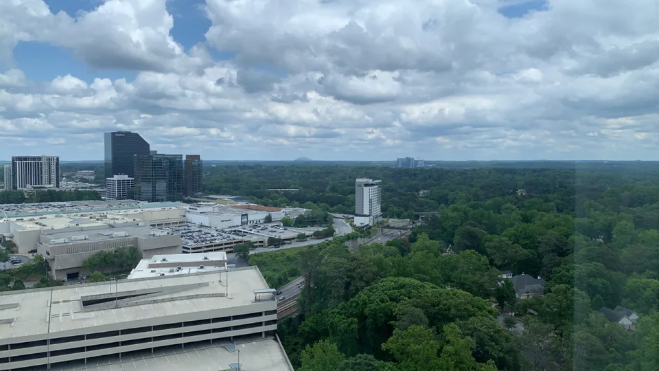 Atlanta skyline behind a foreground of trees