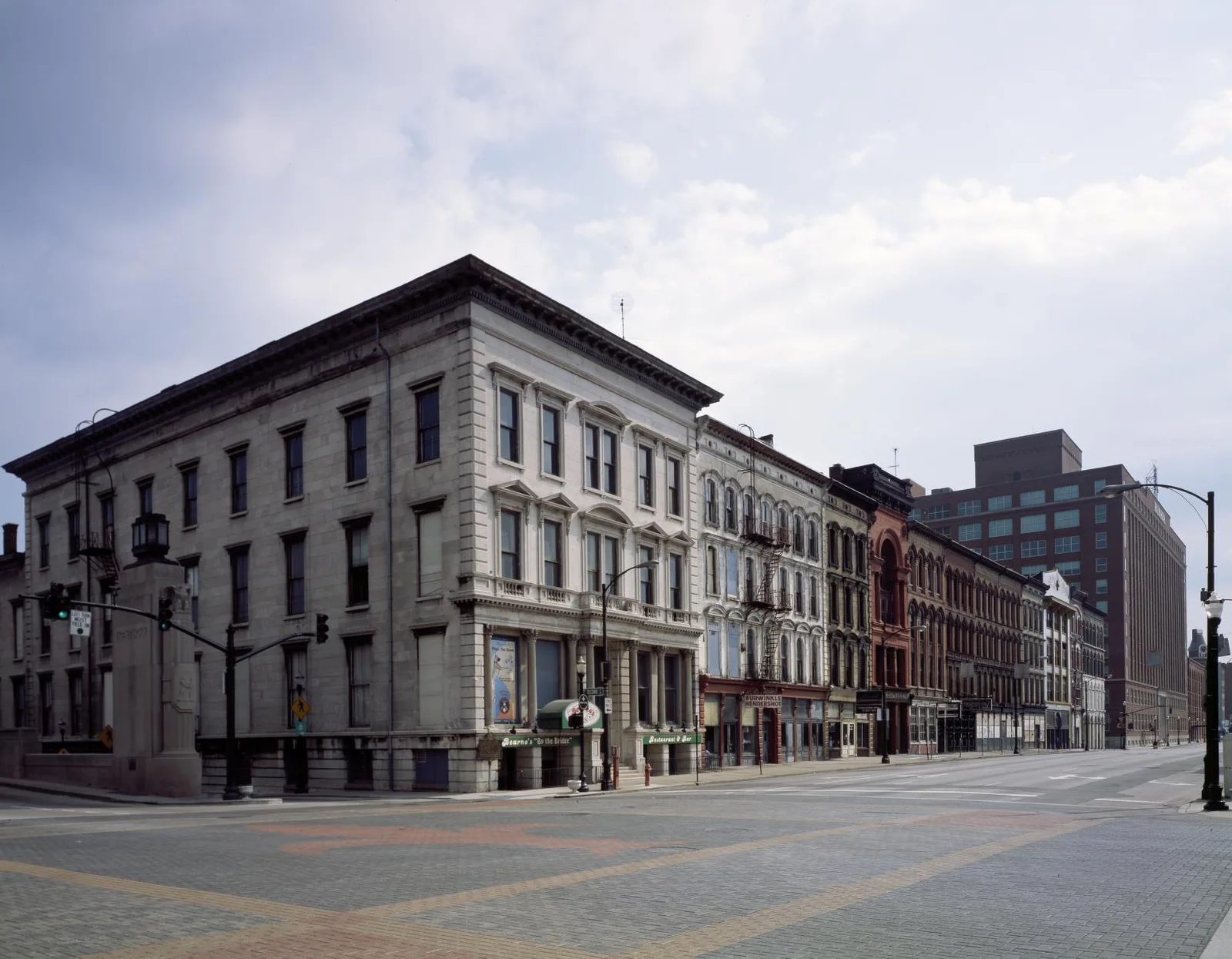 A downtown Louisville street lined with historic commercial facades