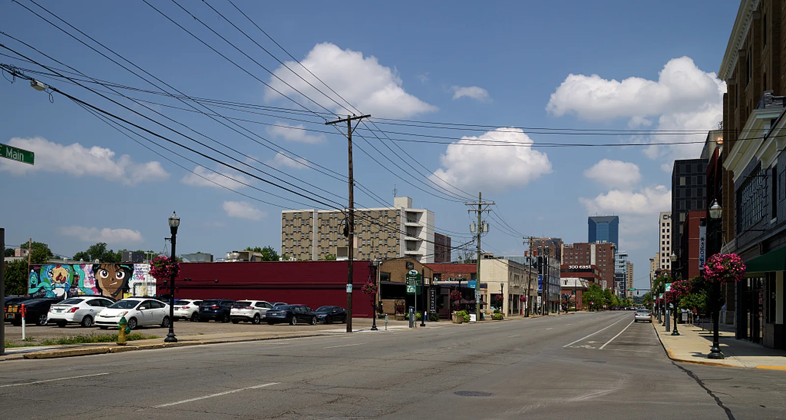 East Main Street in Lexington with low-rise storefronts and distant taller buildings