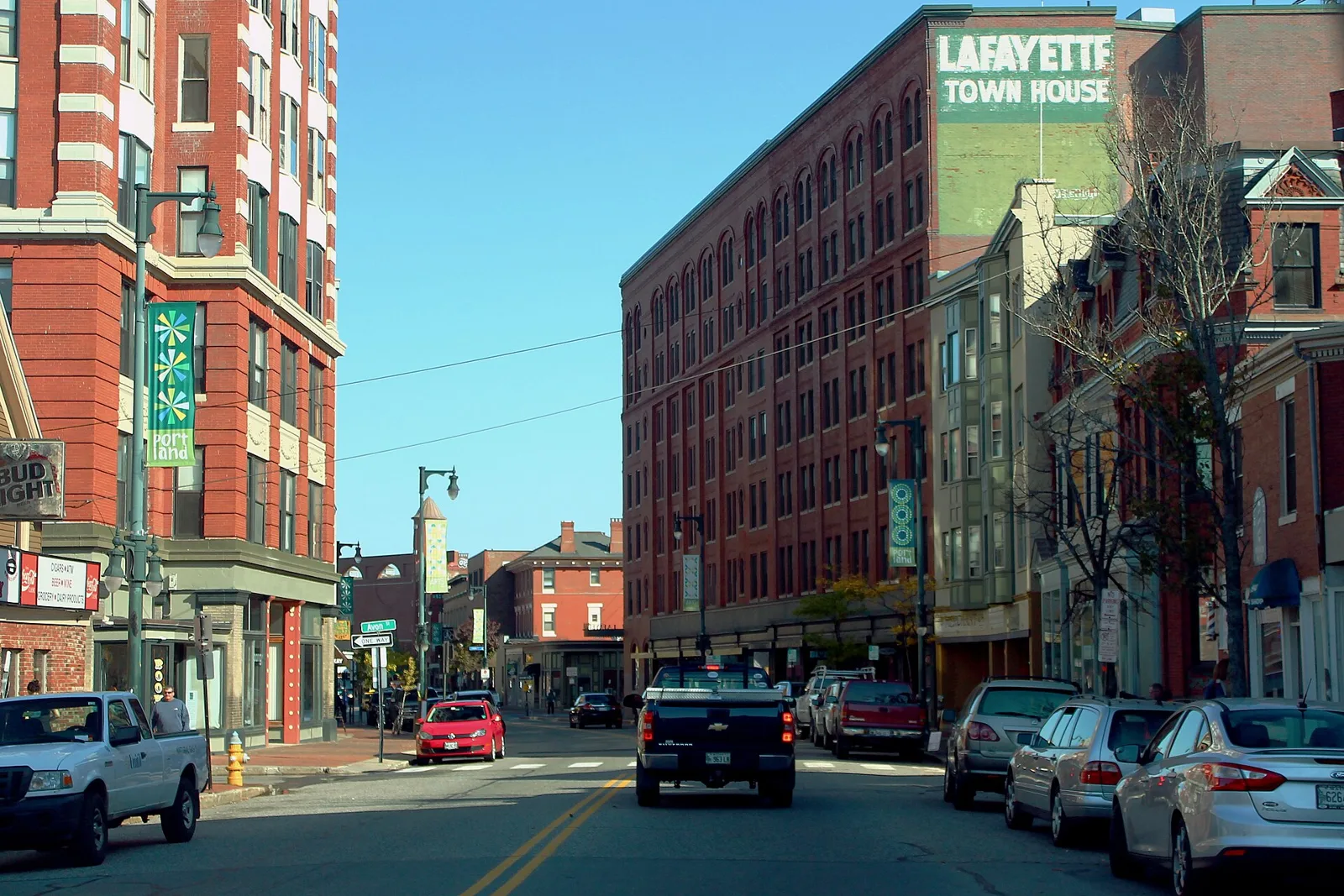 Multi-story buildings and traffic along Congress Street in Portland, Maine