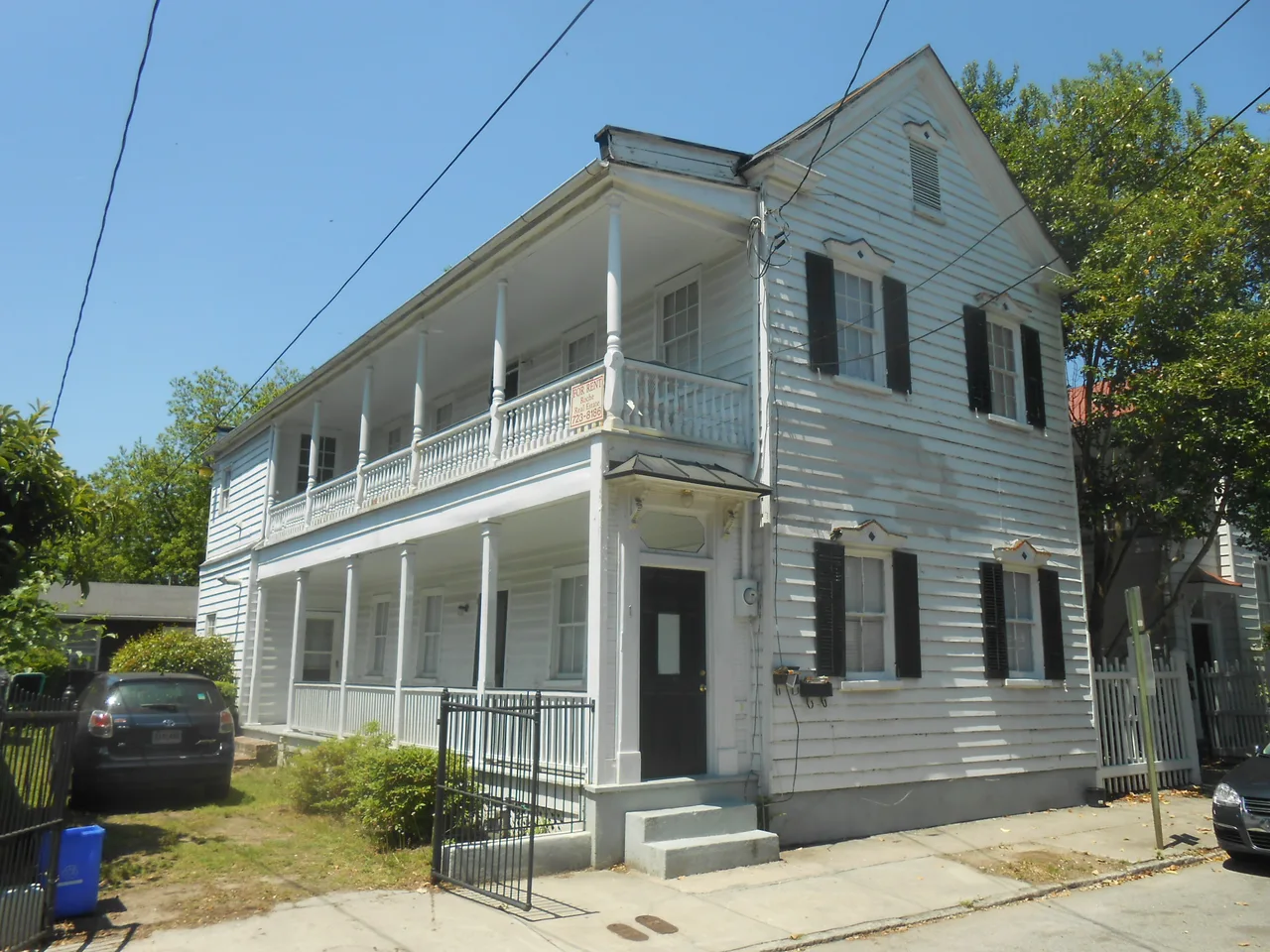 Wooden house with two levels of side porches at 1 Ashe Street in Charleston